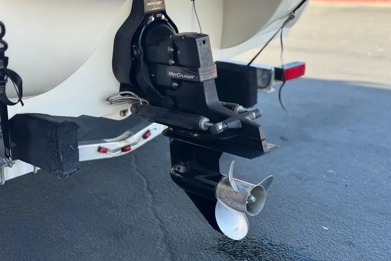 Slide: The Image of 2018 Stingray 208 LS boat with MerCruiser outboard motor and propeller. - 8