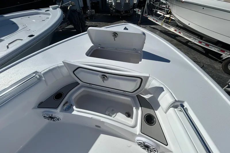 Slide: The Image of 2026 Sportsman Masters 267OE Bay Boat with open storage compartments and sleek design. - 10