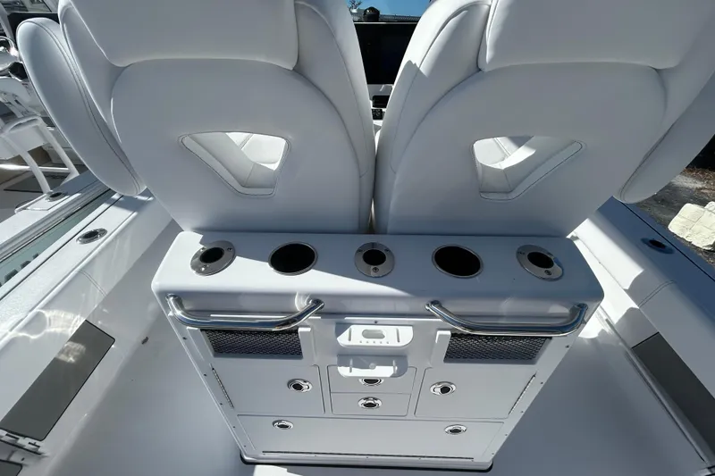 Slide: The Image of 2026 Sportsman Masters 267OE Bay Boat interior with seating and storage compartments. - 13