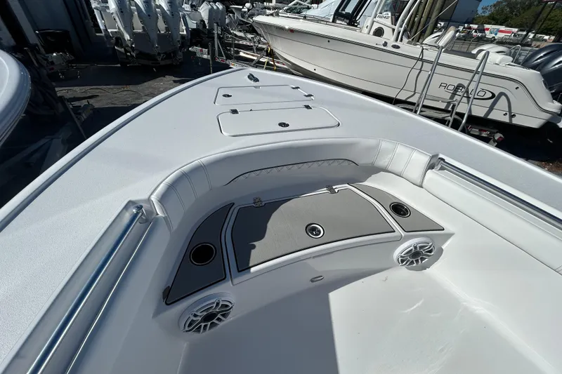Slide: The Image of 2026 Sportsman Masters 267OE Bay Boat interior with seating and storage compartments. - 7