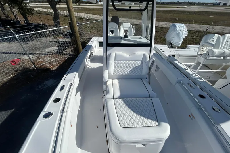 Slide: The Image of 2026 Sportsman Masters 267OE Bay Boat with white seating and sleek design. - 8