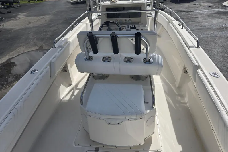 Slide: The Image of 1998 Fountain 25 Center Console boat interior with steering and seating area. - 13
