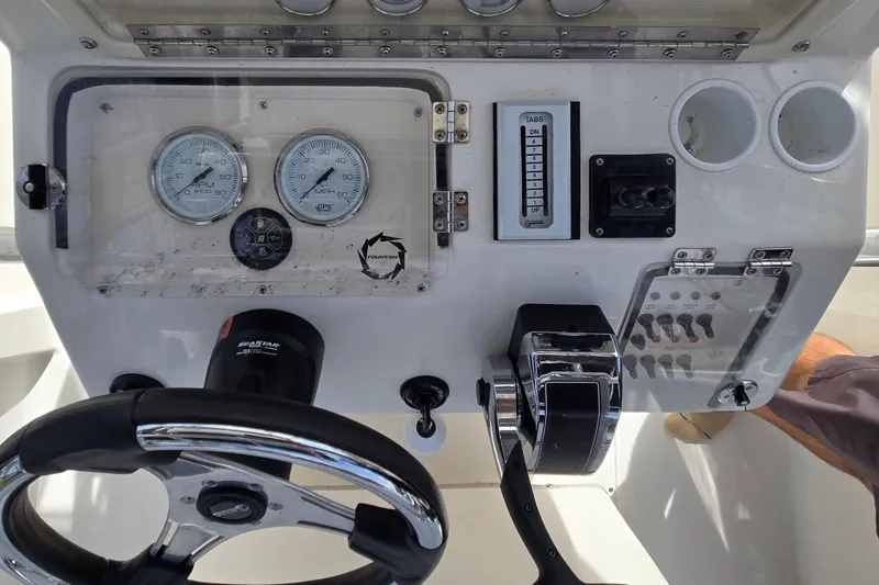 Slide: The Image of 1998 Fountain 25 Center Console dashboard with gauges and controls. - 17