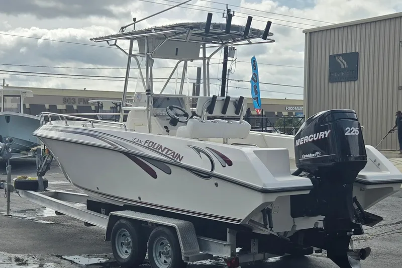Slide: The Image of 1998 Fountain 25 Center Console boat with Mercury 225 engine on trailer. - 5