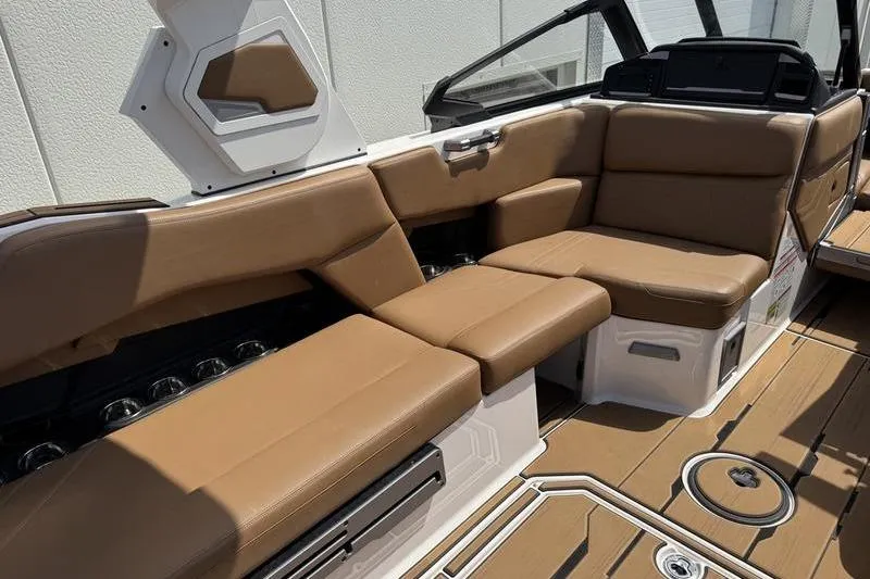 Slide: The Image of 2024 Supra SE 575 boat interior with tan leather seating and modern design. - 9