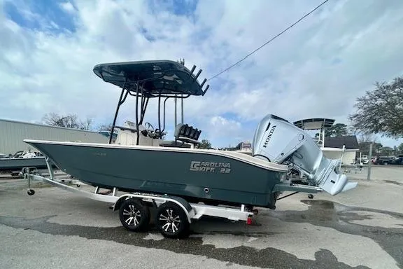 Slide: The Image of 2026 Carolina Skiff 22 Ultra Elite boat on trailer with Honda outboard motor. - 4