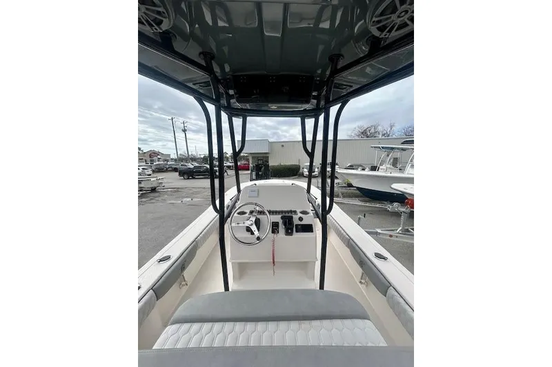 Slide: The Image of 2026 Carolina Skiff 22 Ultra Elite boat interior with steering console and seating. - 8