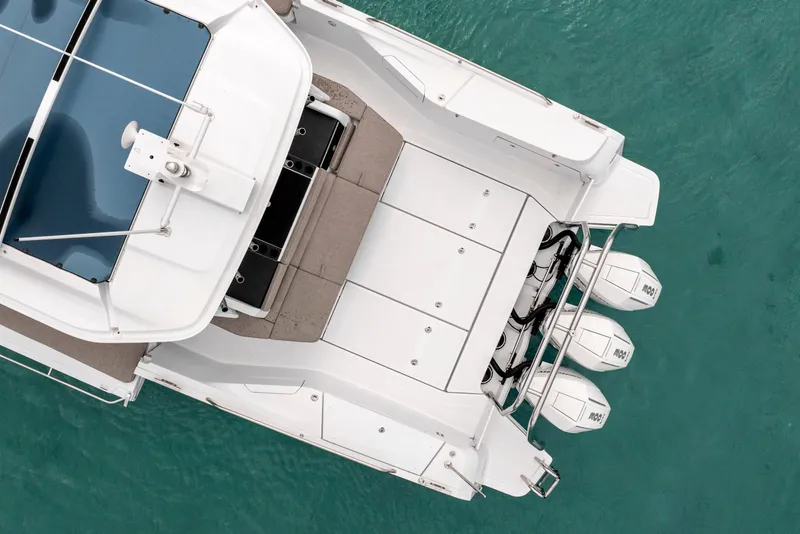 Slide: The Image of Overhead view of 2025 Axopar 45 Cross Top boat on turquoise water. - 18