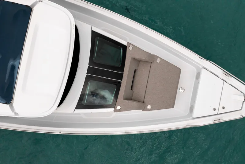 Slide: The Image of Top view of 2025 Axopar 45 Cross Top boat on turquoise water. - 3