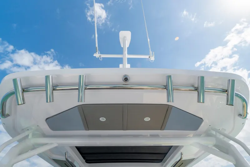 Slide: The Image of 2025 Axopar 45 Cross Top boat against a clear blue sky. - 47