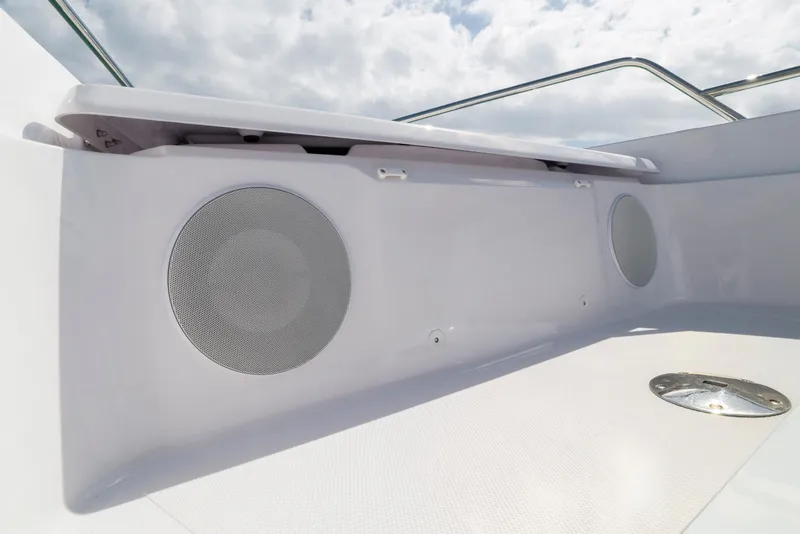 Slide: The Image of 2025 Axopar 45 Cross Top boat interior with built-in speakers and sleek design. - 52