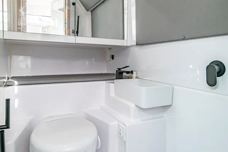 Slide: The Image of Modern bathroom interior of 2025 Axopar 45 Cross Top boat, featuring sleek fixtures. - 62