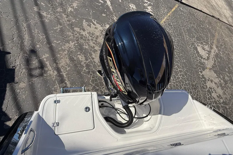 Slide: The Image of 2024 Robalo R230 Center Console boat with powerful outboard motor. - 10