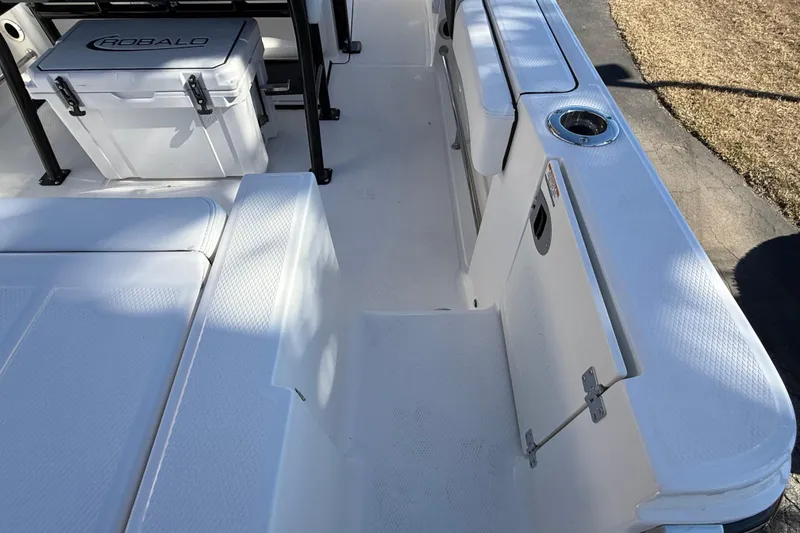Slide: The Image of 2024 Robalo R230 Center Console boat interior with seating and storage. - 15
