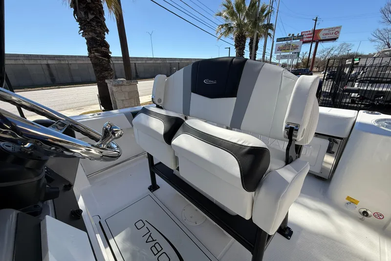 Slide: The Image of 2024 Robalo R230 Center Console boat interior with sleek seating and steering wheel. - 25