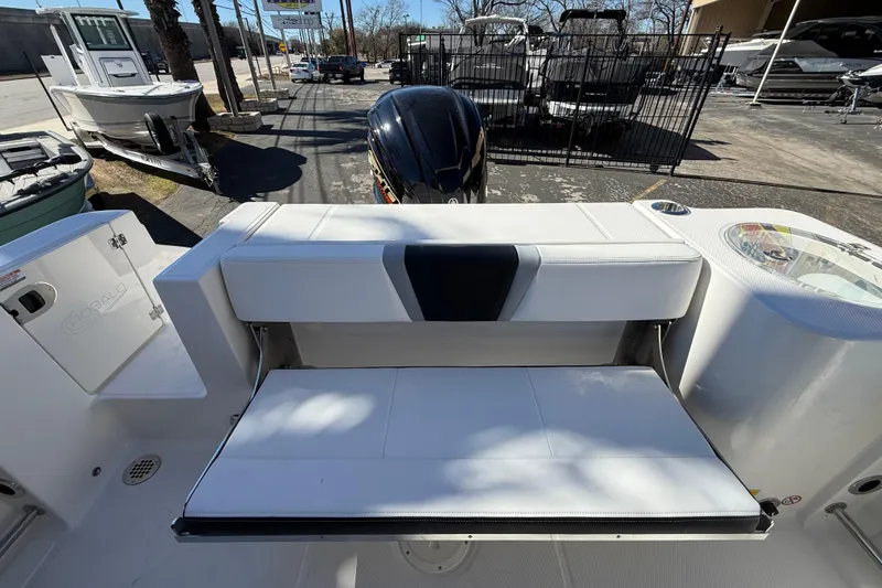 Slide: The Image of 2024 Robalo R230 Center Console boat with foldable seating and storage. - 34