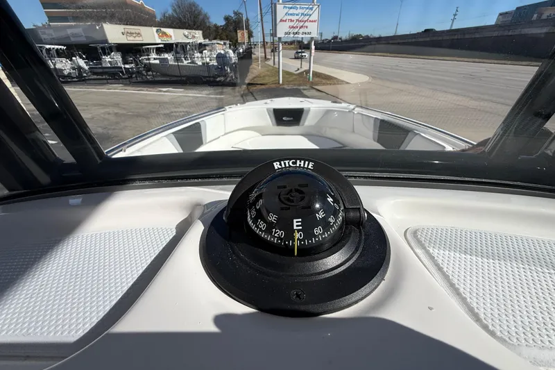 Slide: The Image of 2024 Robalo R230 Center Console boat with Ritchie compass on dashboard. - 39