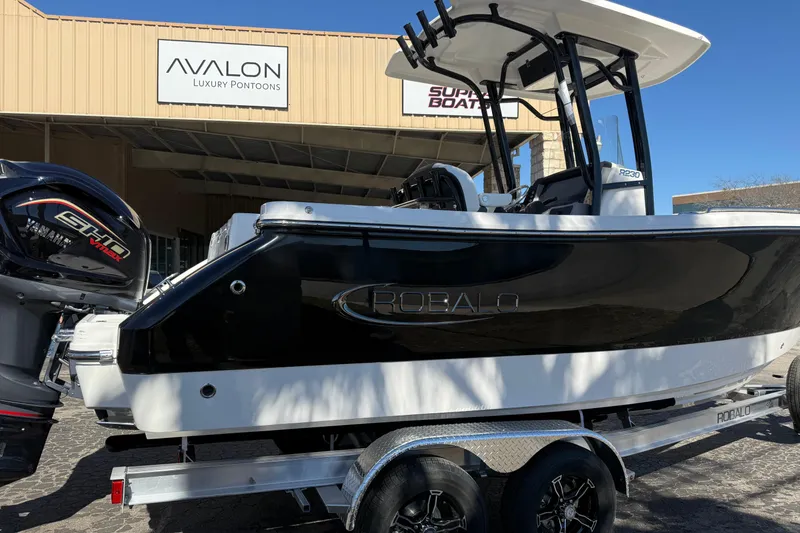 Slide: The Image of 2024 Robalo R230 Center Console boat at Avalon Luxury Pontoons dealership. - 4