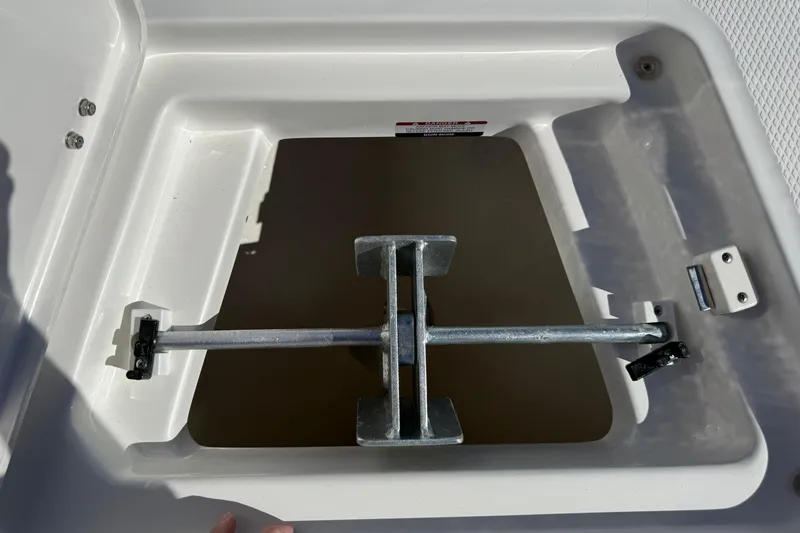 Slide: The Image of Anchor storage compartment on 2024 Robalo R230 Center Console boat. - 49