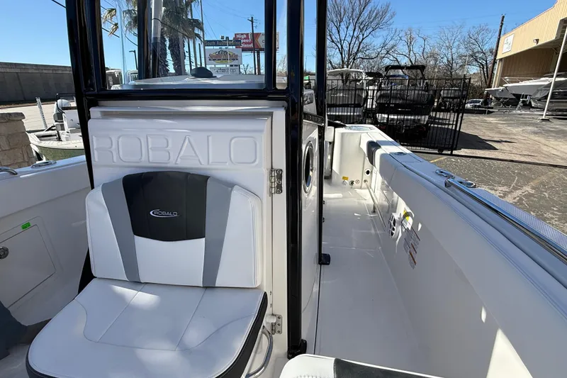 Slide: The Image of 2024 Robalo R230 Center Console boat interior with seating and console details. - 56