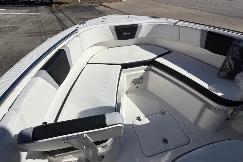 Slide: The Image of 2024 Robalo R230 Center Console boat interior with white cushioned seating. - 59