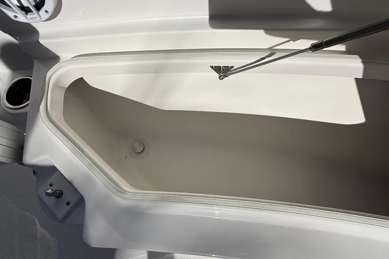 Slide: The Image of 2024 Robalo R230 Center Console storage compartment with hydraulic lift support. - 62