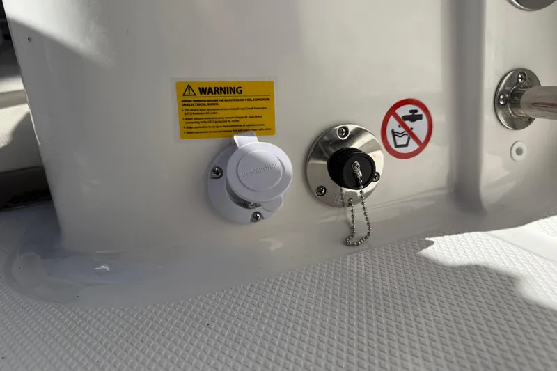Slide: The Image of 2024 Robalo R230 Center Console boat warning labels and connectors. - 67