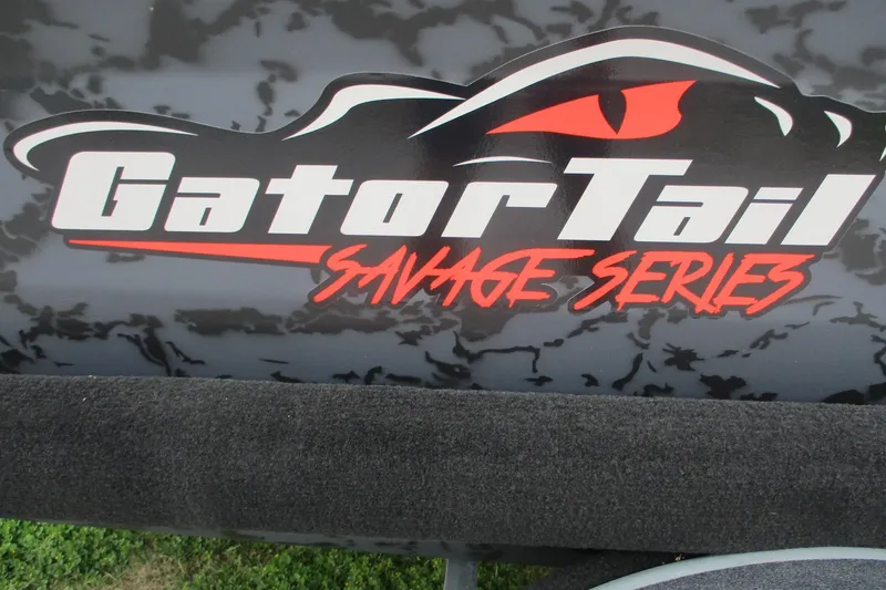 Slide: The Image of Gator Tail 1750 MID DECK SAVAGE 2026 logo with bold red and white text. - 12