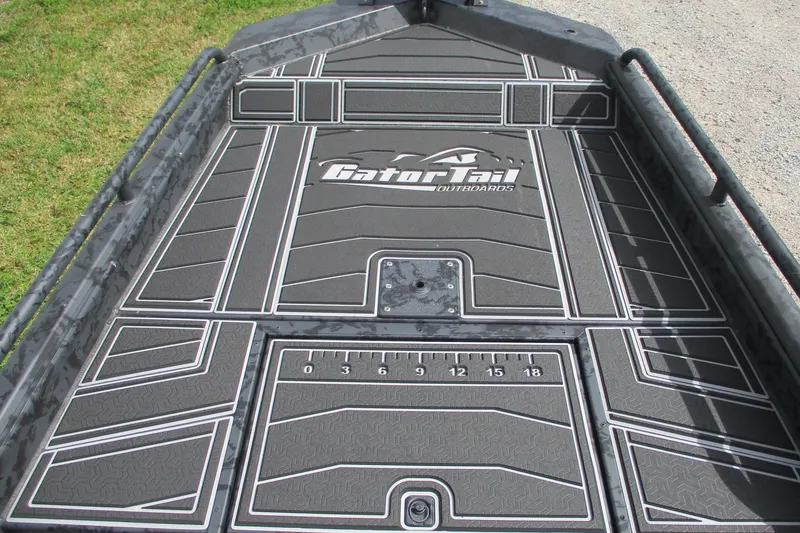 Slide: The Image of 2026 Gator Tail 1750 MID DECK SAVAGE boat deck with custom design and logo. - 4