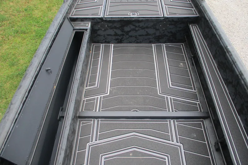 Slide: The Image of Interior view of 2026 Gator Tail 1750 MID DECK SAVAGE boat with patterned flooring. - 6