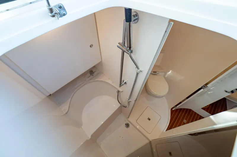 Slide: The Image of 2019 Intrepid 407 Cuddy bathroom with shower and toilet. - 104