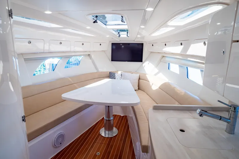 Slide: The Image of Luxurious interior of 2019 Intrepid 407 Cuddy boat with modern seating and amenities. - 106