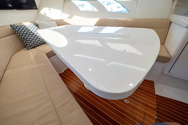 Slide: The Image of Luxurious interior of 2019 Intrepid 407 Cuddy with sleek table and comfortable seating. - 113