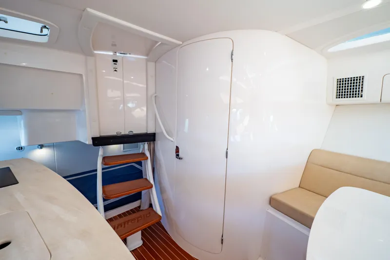 Slide: The Image of Interior of 2019 Intrepid 407 Cuddy boat with seating and stairs. - 121