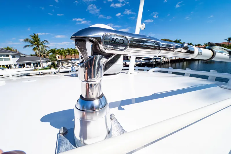 Slide: The Image of Close-up of a 2019 Intrepid 407 Cuddy boat's polished metal fitting under a clear blue sky. - 123