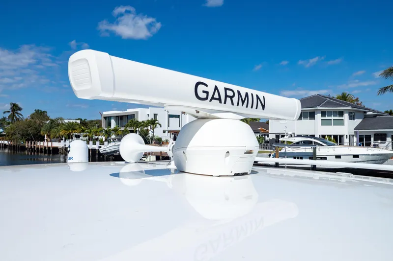 Slide: The Image of 2019 Intrepid 407 Cuddy with Garmin radar, docked near waterfront homes. - 124