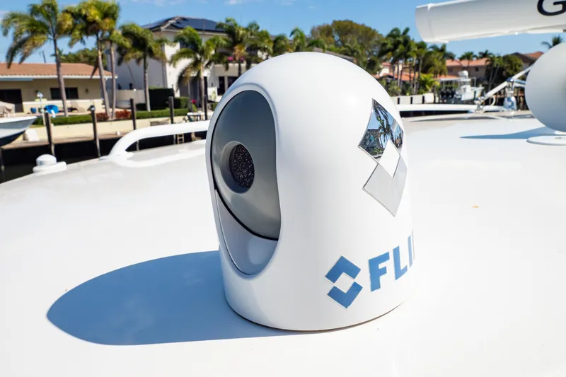 Slide: The Image of FLIR camera on 2019 Intrepid 407 Cuddy boat deck, with waterfront background. - 125