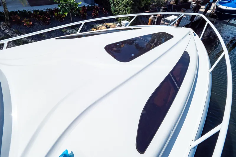 Slide: The Image of 2019 Intrepid 407 Cuddy boat deck with sleek design and tinted windows. - 126