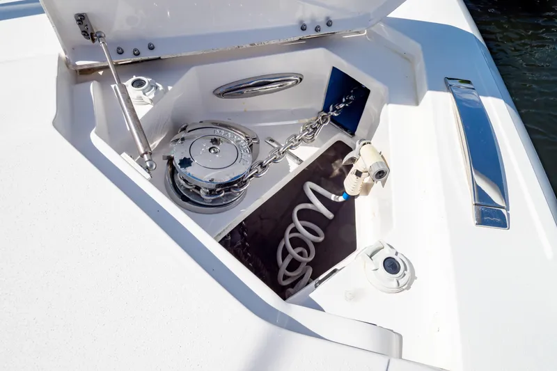 Slide: The Image of 2019 Intrepid 407 Cuddy anchor compartment with chain and winch system. - 127