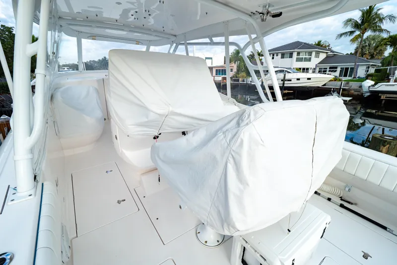 Slide: The Image of 2019 Intrepid 407 Cuddy boat interior with covered seating and sleek design. - 129