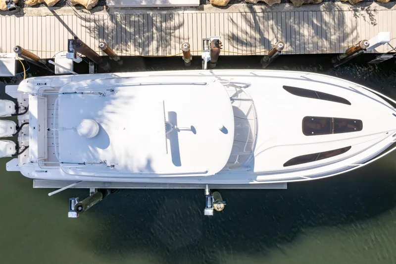 Slide: The Image of Overhead view of 2019 Intrepid 407 Cuddy boat docked at a marina. - 21