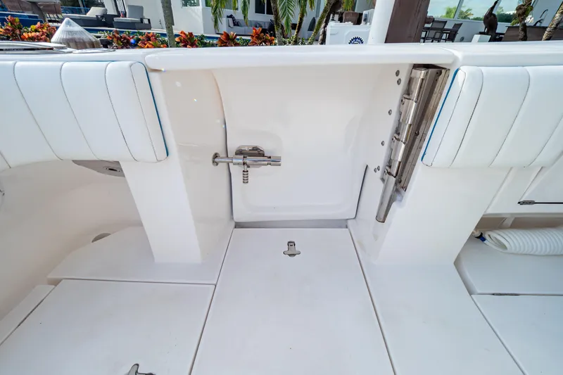 Slide: The Image of 2019 Intrepid 407 Cuddy boat interior with white seating and deck details. - 30