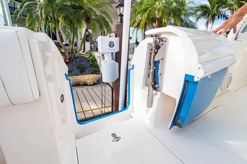 Slide: The Image of 2019 Intrepid 407 Cuddy boat with open transom door, tropical background. - 31