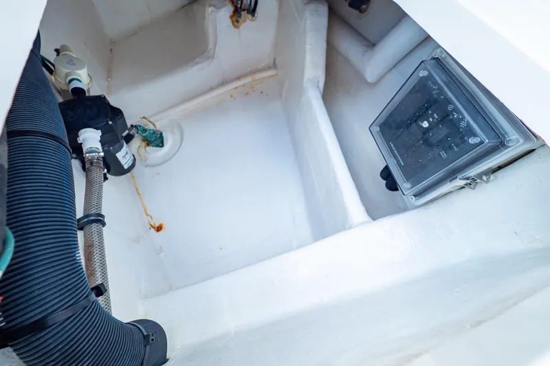 Slide: The Image of 2019 Intrepid 407 Cuddy boat interior with visible wiring and control panel. - 40