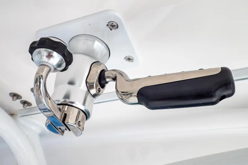 Slide: The Image of Close-up of a 2019 Intrepid 407 Cuddy boat handle and latch mechanism. - 44