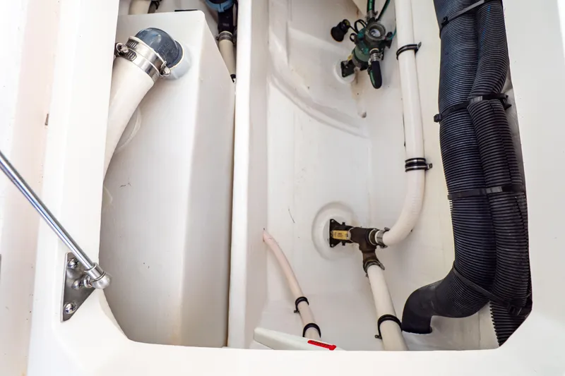 Slide: The Image of 2019 Intrepid 407 Cuddy boat plumbing system with hoses and fittings. - 51