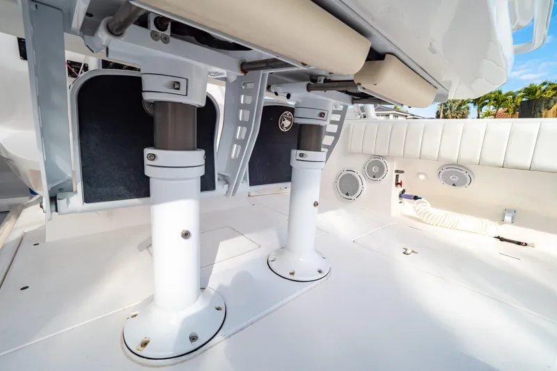 Slide: The Image of 2019 Intrepid 407 Cuddy boat interior with seating and storage features. - 52