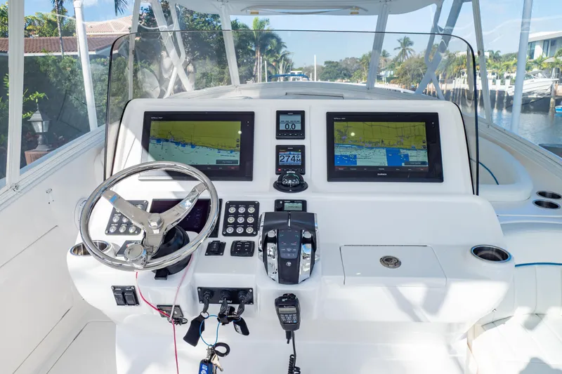 Slide: The Image of 2019 Intrepid 407 Cuddy helm with dual navigation screens and modern controls. - 6