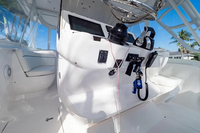 Slide: The Image of 2019 Intrepid 407 Cuddy helm with modern controls and seating, showcasing luxury design. - 66