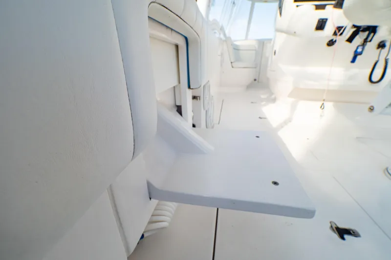 Slide: The Image of 2019 Intrepid 407 Cuddy interior with white seating and fold-out table. - 67